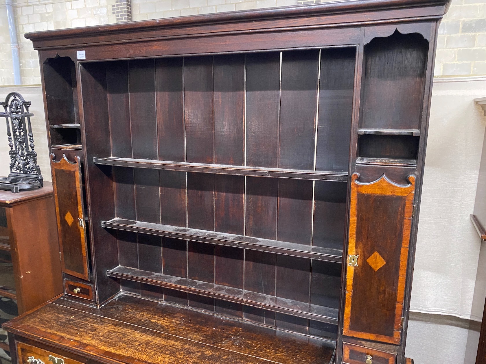 A George III style banded oak dresser, with boarded rack, width 163cm, depth 44cm, height 198cm